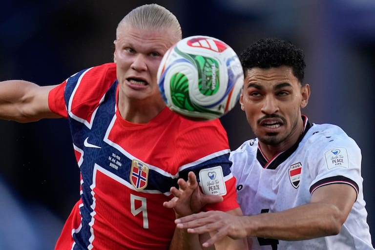 Norway's Erling Haaland (9), left, and Iraq's Zaid Tahseen (4) eye the ball during the World Cup Group I soccer match between Iraq and Norway in Foxborough, Mass., near Boston, Tuesday, June 16, 2026. (AP Photo/Charles Krupa)