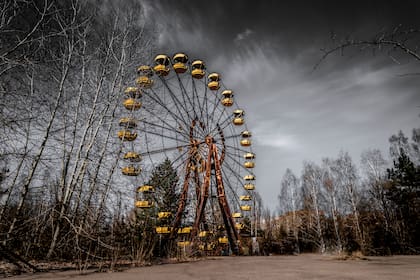 Old ferris wheel in the ghost town of Pripyat. Consequences of the accident at the Chernobil nuclear power plant