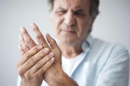Old man with finger pain