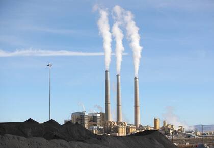 PacifiCorp's Hunter coal fired power pant releases steam as it burns coal outside of Castle Dale, Utah on November 14, 2019. - The 1,577 Megawatt power pant opened in 1978 and is one of the largest coal fired plants in the western United States. (Photo by GEORGE FREY / AFP) (Photo by GEORGE FREY/AFP via Getty Images)