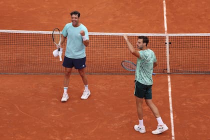 PARIS, FRANCE - JUNE 05: Marcel Granollers of Spain and Horacio Zeballos of Argentina celebrate a point against Andrea Vavassori and Simone Bolelli of Italy in their Men's Doubles semi-final match on Day Thirteen of the 2026 French Open at Roland Garros on June 05, 2026 in Paris, France. (Photo by Dan Istitene/Getty Images)