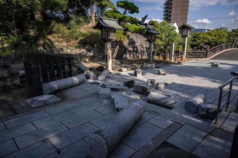 Part of the Yatsushiro Shrine is seen damaged in Yatsushiro, Kumamoto prefecture on July 29, 2026, after an earthquake struck southwestern Japan the previous day. (Photo by Yuichi YAMAZAKI / AFP)