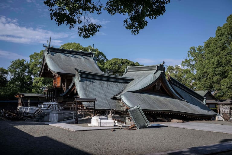 Part of the Yatsushiro Shrine is seen damaged in Yatsushiro, Kumamoto prefecture on July 29, 2026, after an earthquake struck southwestern Japan the previous day. (Photo by Yuichi YAMAZAKI / AFP)