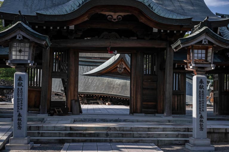Part of the Yatsushiro Shrine is seen damaged in Yatsushiro, Kumamoto prefecture on July 29, 2026, after an earthquake struck southwestern Japan the previous day. (Photo by Yuichi YAMAZAKI / AFP)