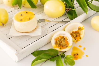 Passion fruit dessert with freshly cut maracuja or passion fruit