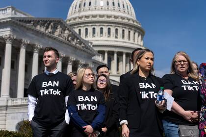 People calling for the banning of TikTok, the hugely popular video-sharing app, attend a news conference at the Capitol in Washington, Thursday, March 23, 2023. (AP Photo/J. Scott Applewhite)