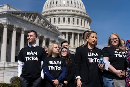 People calling for the banning of TikTok, the hugely popular video-sharing app, attend a news conference at the Capitol in Washington, Thursday, March 23, 2023. (AP Photo/J. Scott Applewhite)