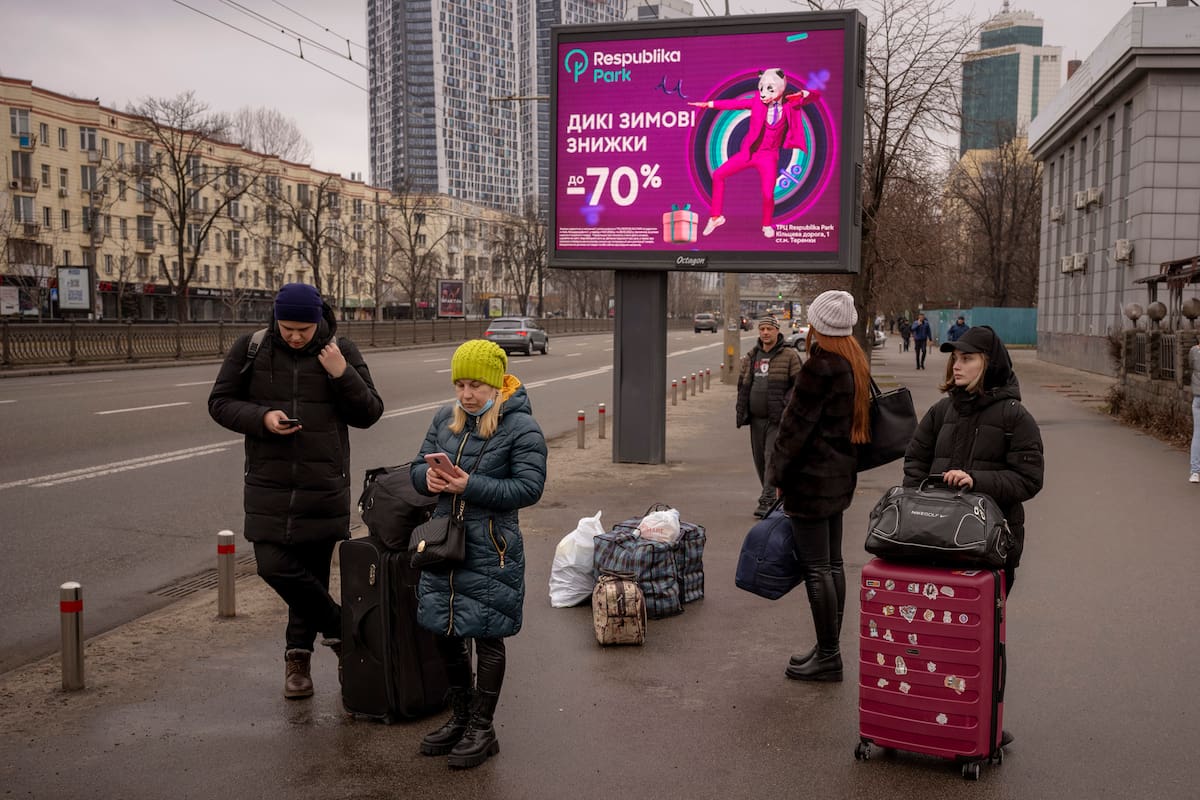 People wait for public transportation as they try to leave Kyiv, Ukraine, Thursday, Feb. 24, 2022. Russian troops have launched their anticipated attack on Ukraine. Big explosions were heard before dawn in Kyiv, Kharkiv and Odesa as world leaders decried the start of an Russian invasion that could cause massive casualties and topple Ukraine's democratically elected government. (AP Photo/Emilio Morenatti)