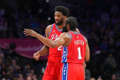 PHILADELPHIA, PA - MARCH 14: Joel Embiid #21 of the Philadelphia 76ers talks with James Harden #1 against the Denver Nuggets at the Wells Fargo Center on March 14, 2022 in Philadelphia, Pennsylvania. The Nuggets defeated the 76ers 114-110. NOTE TO USER: User expressly acknowledges and agrees that, by downloading and or using this photograph, User is consenting to the terms and conditions of the Getty Images License Agreement. (Photo by Mitchell Leff/Getty Images)