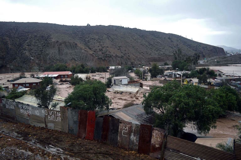 Picture released by ATON of a rural area in La Serena, Coquimbo region, Chile, on July 21, 2026, following severe weather conditions. Heavy rains in Chile have killed at least 13 people and left more than 60,000 others cut off due to washed out roads, government officials said in a report on July 21, 2026, as the recovery effort focused on restoring basic services. (Photo by Alejandro PIZARRO / ATON CHILE / AFP) / - Chile OUT / RESTRICYED TO EDITORIAL USE - MANDATORY CREDIT AFP PHOTO / ATON / ALEJANDRO PIZARRO - NO MARKETING NO ADVERTISING CAMPAIGNS -DISTRIBUTED AS A SERVICE TO CLIENTS