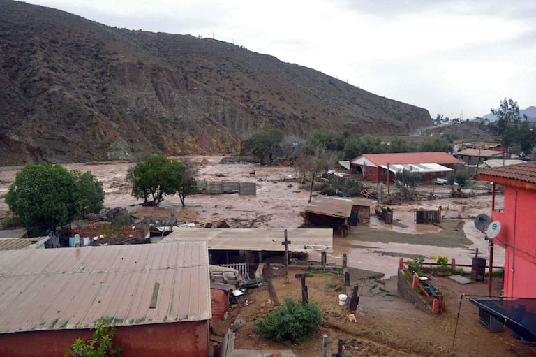 Picture released by ATON of a rural area in La Serena, Coquimbo region, Chile, on July 21, 2026, following severe weather conditions. Heavy rains in Chile have killed at least 13 people and left more than 60,000 others cut off due to washed out roads, government officials said in a report on July 21, 2026, as the recovery effort focused on restoring basic services. (Photo by Alejandro PIZARRO / ATON CHILE / AFP) / - Chile OUT / RESTRICYED TO EDITORIAL USE - MANDATORY CREDIT AFP PHOTO / ATON / ALEJANDRO PIZARRO - NO MARKETING NO ADVERTISING CAMPAIGNS -DISTRIBUTED AS A SERVICE TO CLIENTS