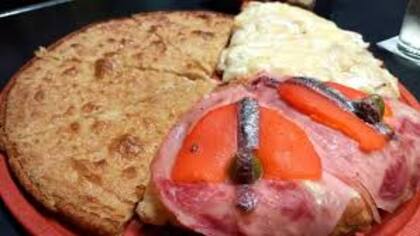 Pizza de molde, fainá y moscato, un clásico desde 1952