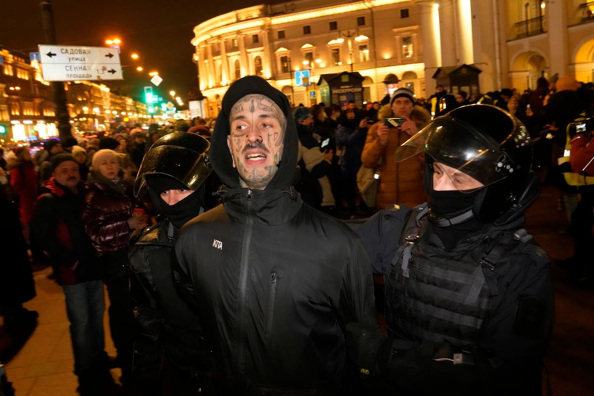 Police officers detain a demonstrator during a gathering in St. Petersburg, Russia, Thursday, Feb. 24, 2022, after Russia's attack on Ukraine. Hundreds of people gathered in the center of Moscow on Thursday, to protest against Russia's attack on Ukraine and many of the demonstrators were detained. Similar protests took place in other Russian cities, where activists were also arrested. (AP Photo/Dmitri Lovetsky)