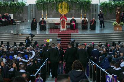 Pope Leo XIV reads his speech at the Catholic basilica of Harissa, Lebanon, Monday, Dec. 1, 2025. (AP Photo/Hussein Malla)