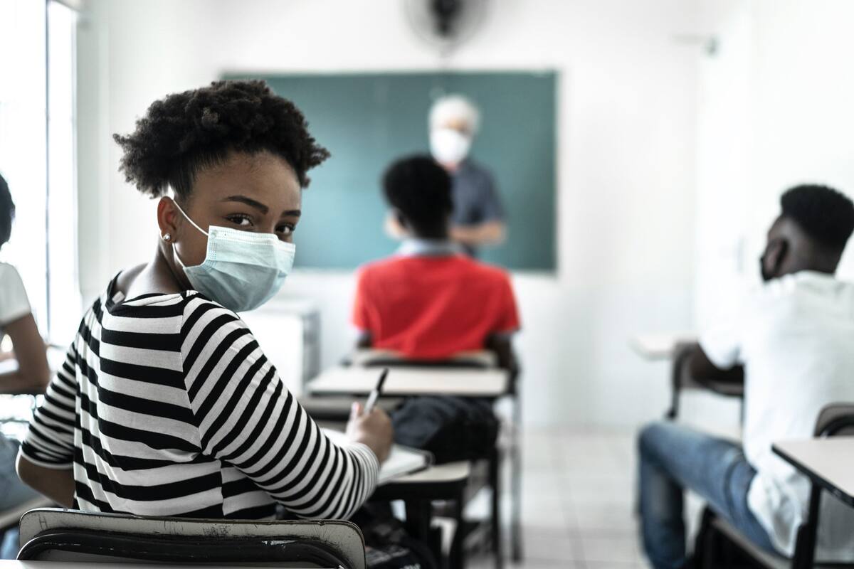 Portrait of an university High school student wearing face mask in the classro