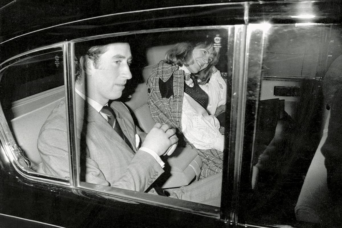 Prince Charles and Camilla Parker Bowles leave a London theater after a night out in the West End February 13, 1975 in London. Prince Charles announced he will wed his longtime lover Camilla Parker Bowles. The wedding will be a civil ceremony in Windsor Castle on April 8, 2005 followed by a service