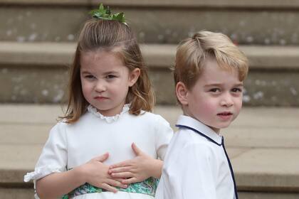Princess Charlotte and Prince George arrive for the wedding of Princess Eugenie to Jack Brooksbank at St Georges Chapel in Windsor Castle, Britain October 12, 2018. Steve Parsons/Pool via REUTERS