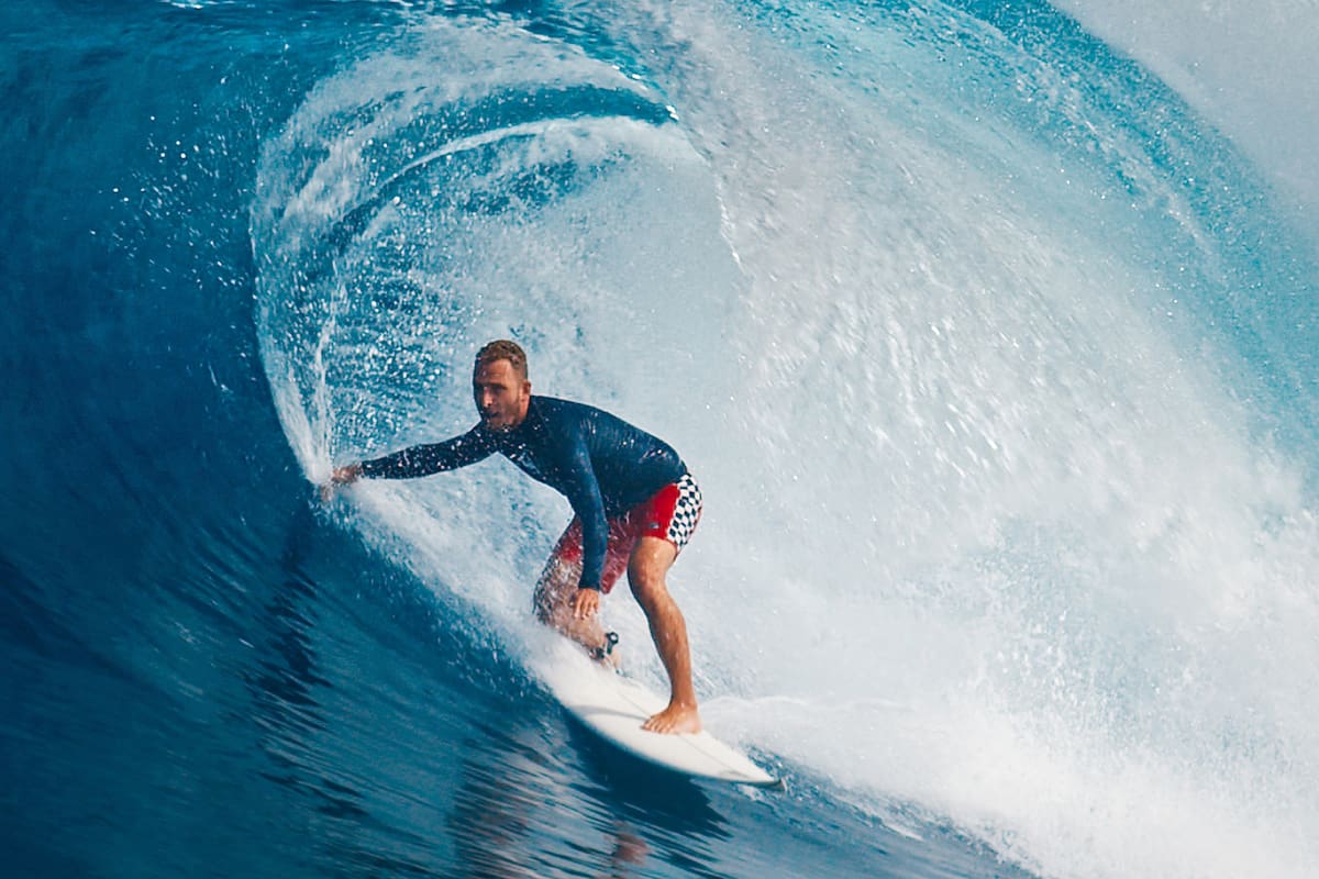 Pro surfer rides big wave in the Maldives