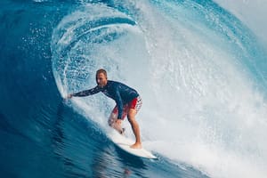 Pro surfer rides big wave in the Maldives