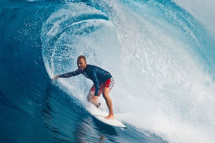Pro surfer rides big wave in the Maldives