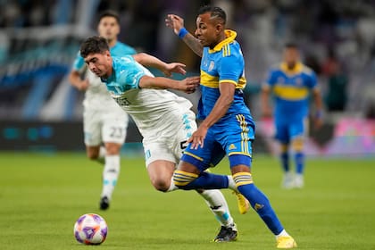 Racing Club's Juan Nardoni, left, and Sebastian Villa of Boca Juniors fight for the ball during Argentinian Super Cup final between Boca Juniors and Racing Club in Abu Dhabi, United Arab Emirates, Friday, Jan. 20, 2023. (AP Photo/Kamran Jebreili)