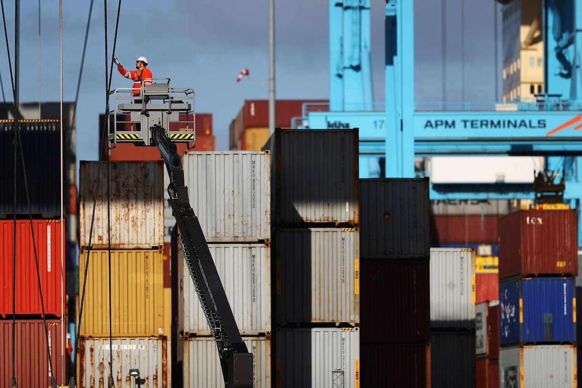 ROTTERDAM, NETHERLANDS - OCTOBER 27: A general view of workers in the yard working on shipping containers and the cranes which move them at the Port of Rotterdam on October 27, 2017 in Rotterdam, Netherlands. The Port of Rotterdam is the largest port in Europe covering 105 square kilometres or 41 sqaure miles and stretches over a distance of 40 kilometres or 25 miles. Its one of the busiest ports in the world handling thousands of cargo containers on a daily basis. (Photo by Dean Mouhtaropoulos/Getty Images)