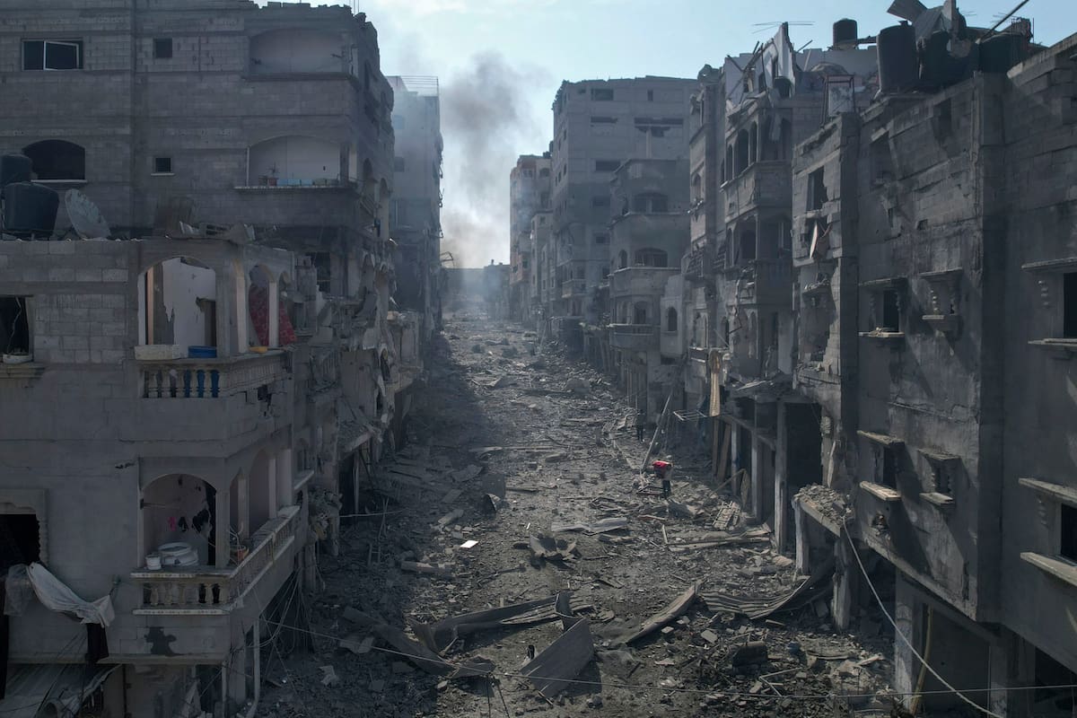 Rubble litters a street between smoldering buildings hit by an Israeli airstrike in Jabaliya, Gaza Strip, Wednesday, Oct. 11, 2023. (AP Photo/Hatem Moussa)