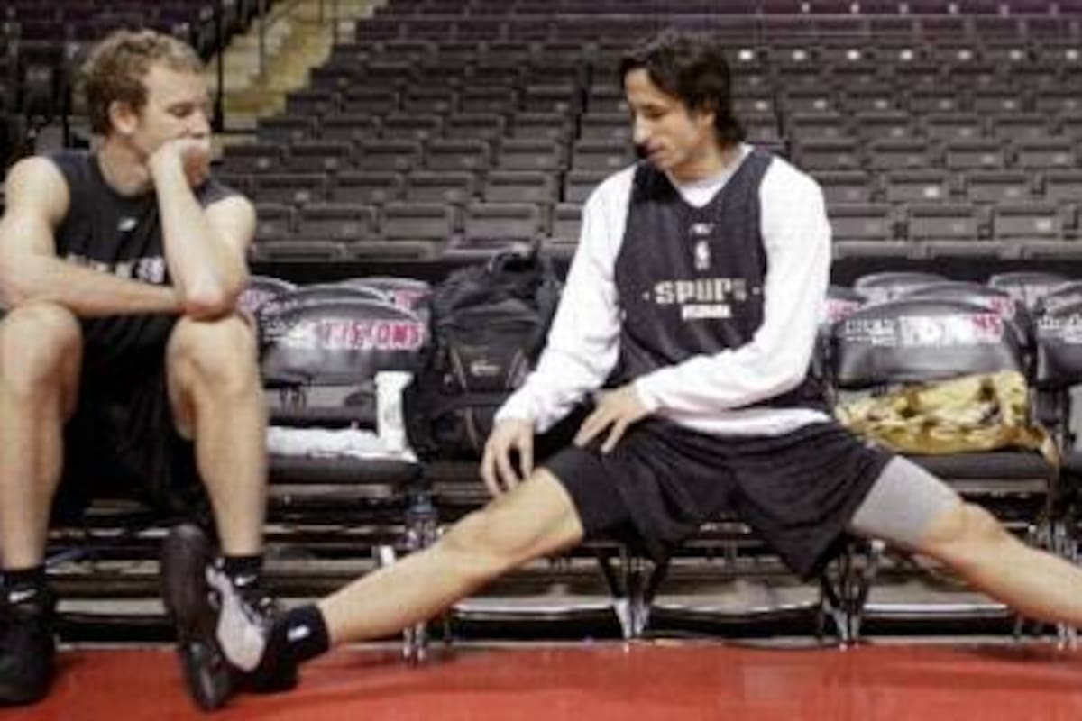 San Antonio Spurs guard Manu Ginobili of Argentina sits on the bench during NBA Finals practice in Auburn Hills, Michigan June 15, 2005. The Spurs lead the Detroit Pistons two games to one.