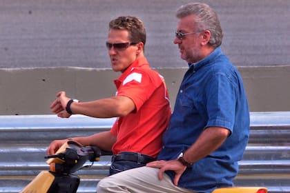 Schumy y Willi Weber en los tiempos de gloria; el representante no quiso acompañar al piloto cuando éste decidió volver a la Fórmula 1 luego de tres temporadas.