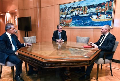 Scioli, Pesce y Guzmán