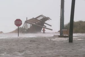 See past storm damage as Hurricanes Humberto and Imelda cause flooding on the Outer Banks