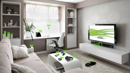 Según Energous, un transmisor escondido detrás de un televisor podría cargar varios dispositivos al mismo tiempo y sin conctacto con ellos