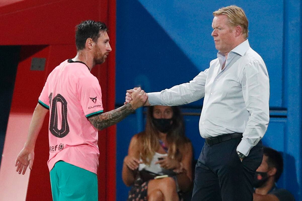 September 16, 2020 Barcelonas Lionel Messi shakes hands with coach Ronald Koeman