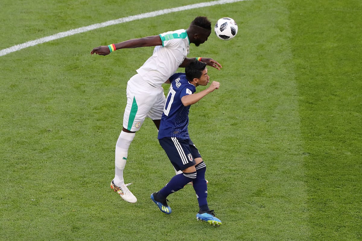 Soccer Football - World Cup - Group H - Japan vs Senegal - Ekaterinburg Arena, Yekaterinburg, Russia - June 24, 2018 Japans Shinji Kagawa in action with Senegals Salif Sane REUTERS/Marcos Brindicci