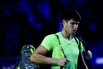Spain's Carlos Alcaraz leaves the court after losing his first round-robin match against  Germany's Alexander Zverev at the ATP Finals tennis tournament in Turin, on November 13, 2023. (Photo by Tiziana FABI / AFP)�