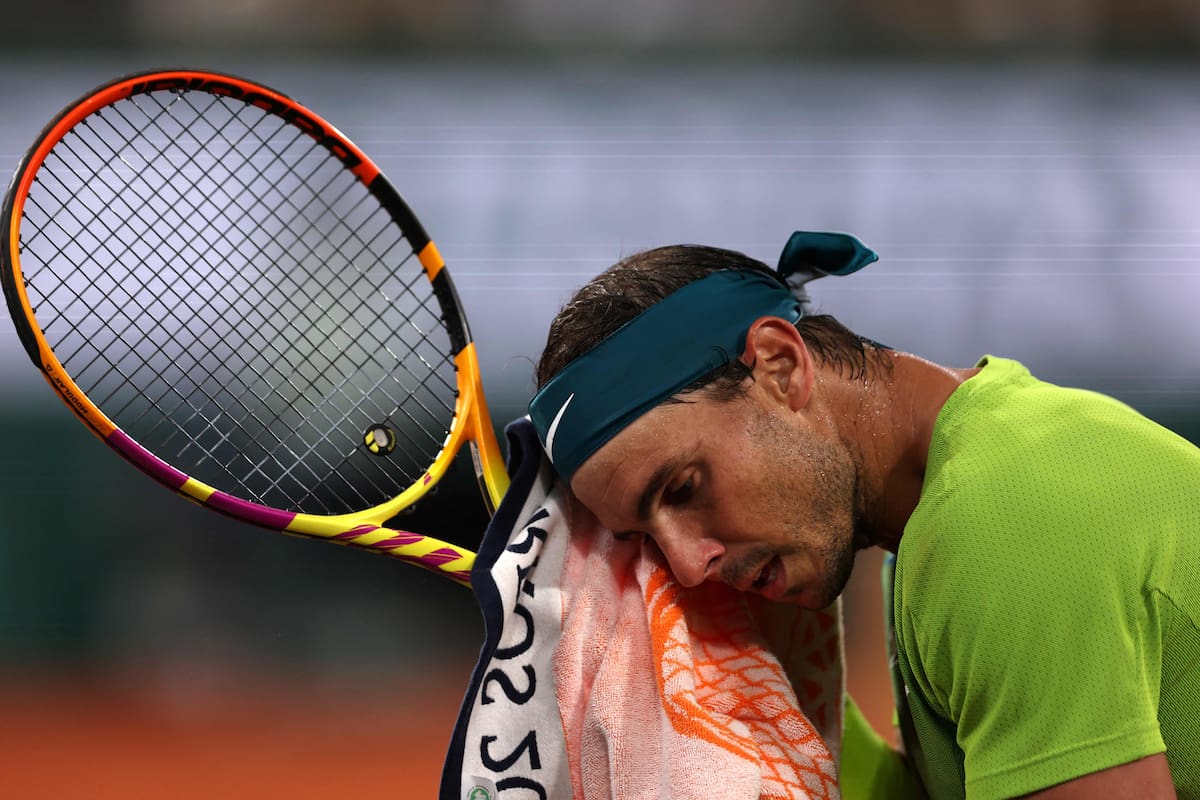 Spain's Rafael Nadal wipes his face with a towel between points against Germany's Alexander Zverev during their men's semi-final singles match on day thirteen of the Roland-Garros Open tennis tournament at the Court Philippe-Chatrier in Paris on June 3, 2022. (Photo by Thomas SAMSON / AFP)