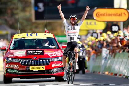 Switzerlands Marc Hirschi celebrates as he crosses the finish line at the end of the 12th stage of the 107th edition of the Tour de France cycling race, 218 km between Chauvigny and Sarran, on September 10, 2020.