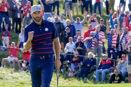Team USA's Dustin Johnson reacts after winning the 11th hole during a four-ball match the Ryder Cup at the Whistling Straits Golf Course Friday, Sept. 24, 2021, in Sheboygan, Wis. (AP Photo/Ashley Landis)