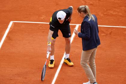 Tennis - French Open - Roland Garros, Paris, France - October 9, 2020 Argentinas Diego Schwartzman speaks with an official during his semi final match against Spains Rafael Nadal