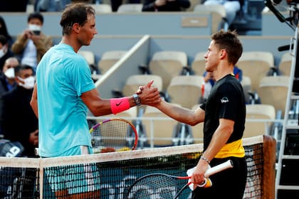 Tennis - French Open - Roland Garros, Paris, France - October 9, 2020 Spains Rafael Nadal shakes hands with Argentinas Diego Schwartzman after winning the semi final match