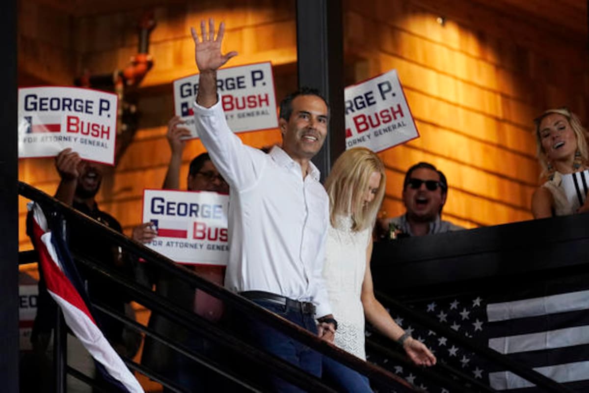 Texas Land Commissioner George P. Bush arrives for a kick-off rally with his wife Amanda to announced he will run for Texas Attorney General, Wednesday, June 2, 2021, in Austin, Texas