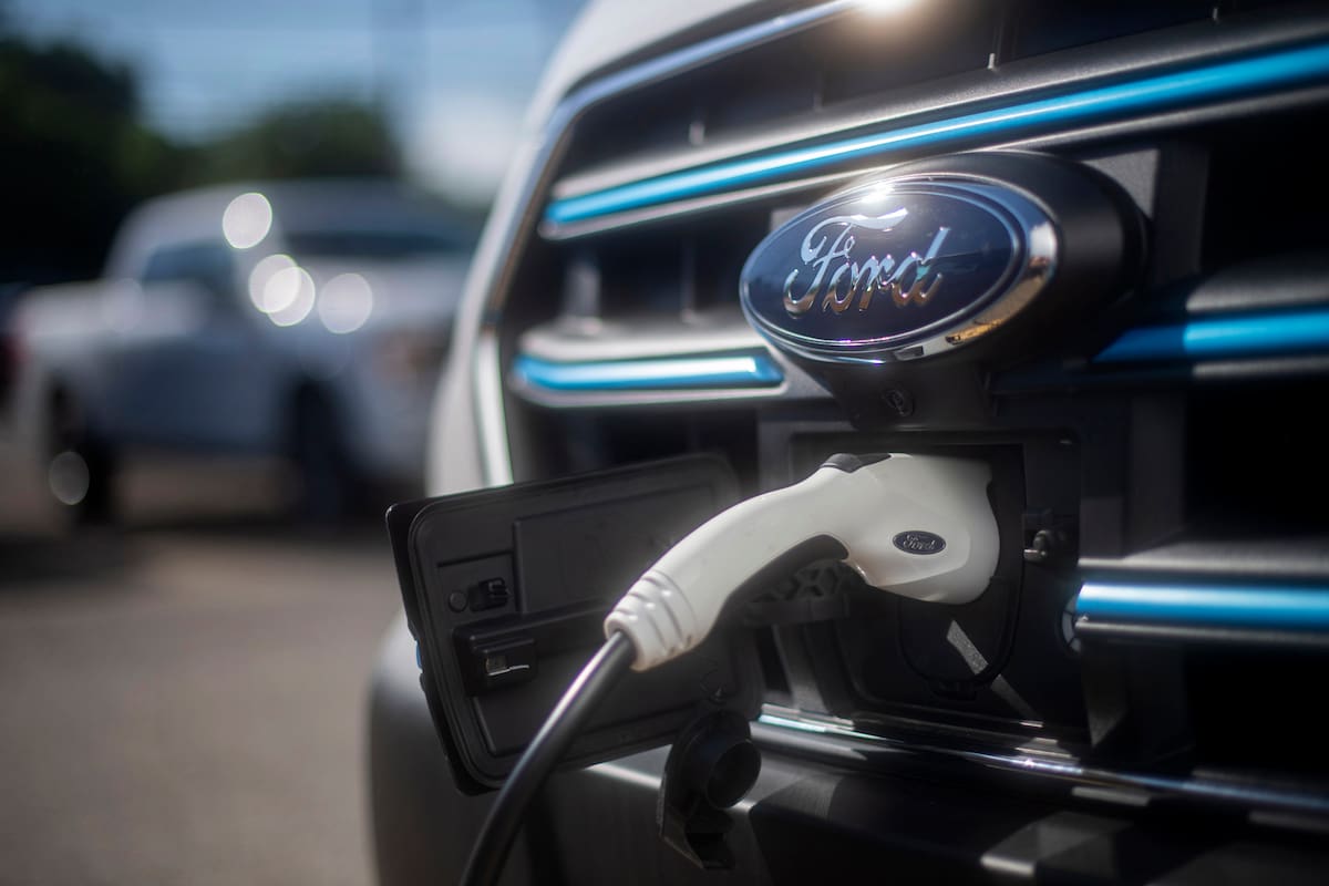 The All-Electric 2022 Ford E-Transit charges Monday, June 27, 2022, at Waltz & Wind Ford, Inc., in Carnegie, Pa. (Morgan Timms/Pittsburgh Post-Gazette via AP)