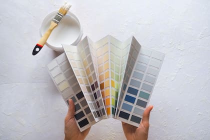 The colour of the enamel in his hands. The choice of paint color for the walls.