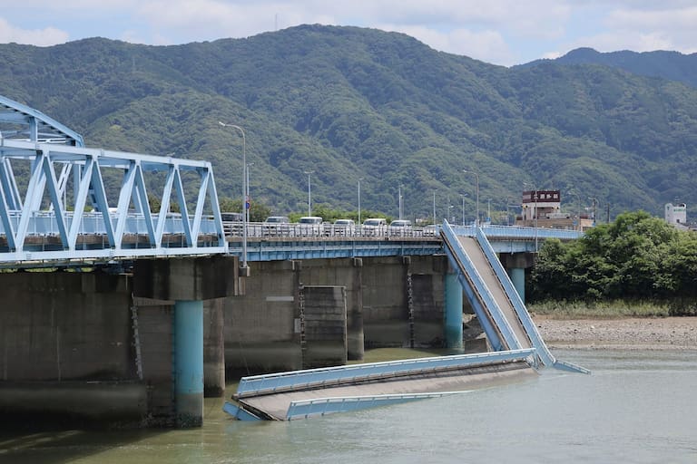 The Ueyanagi Bridge is seen partially colapsed in Yatsushiro, Kumamoto Prefecture, on July 29, 2026, after an earthquake struck southwestern Japan the previous day. (Photo by JIJI PRESS / AFP) / Japan OUT