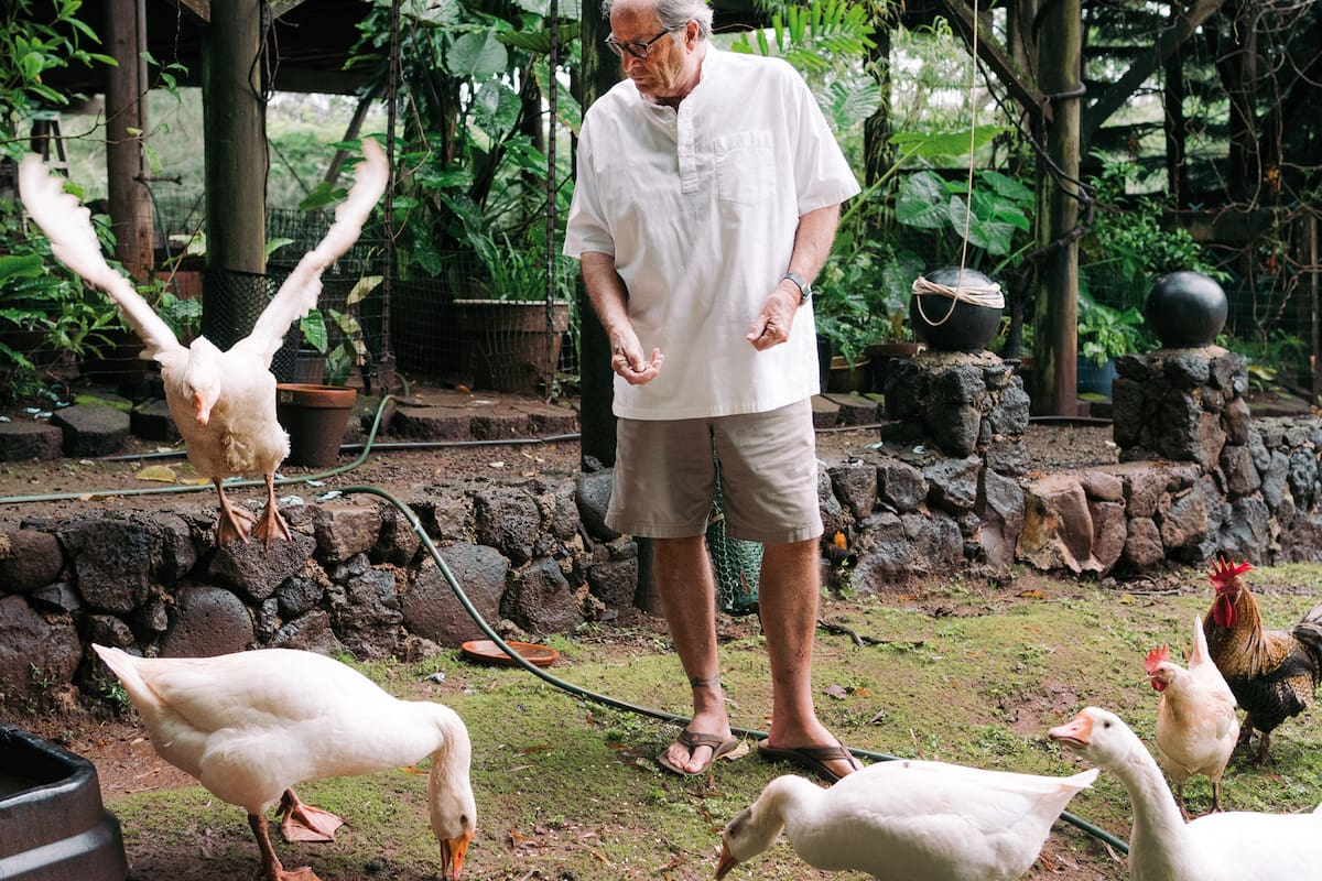 The writer Paul Theroux at his home in Haleiwa, Hawaii, March 15, 2021. Would the coronavirus pandemic stop Theroux from traveling? No. Of course not. (Michelle Mishina Kunz/The New York Times)