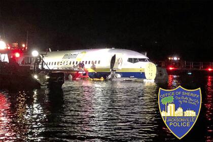 This handout image obtained courtesy of Jacksonville, Florida, Sheriffs Office on May 3, 2019, shows a Boeing 737 aircraft after it went off the runway at Naval Air Station Jacksonville and into the St. Johns river, near Jacksonville, Florida on May 3, 2019. - The plane with 136 people on board was