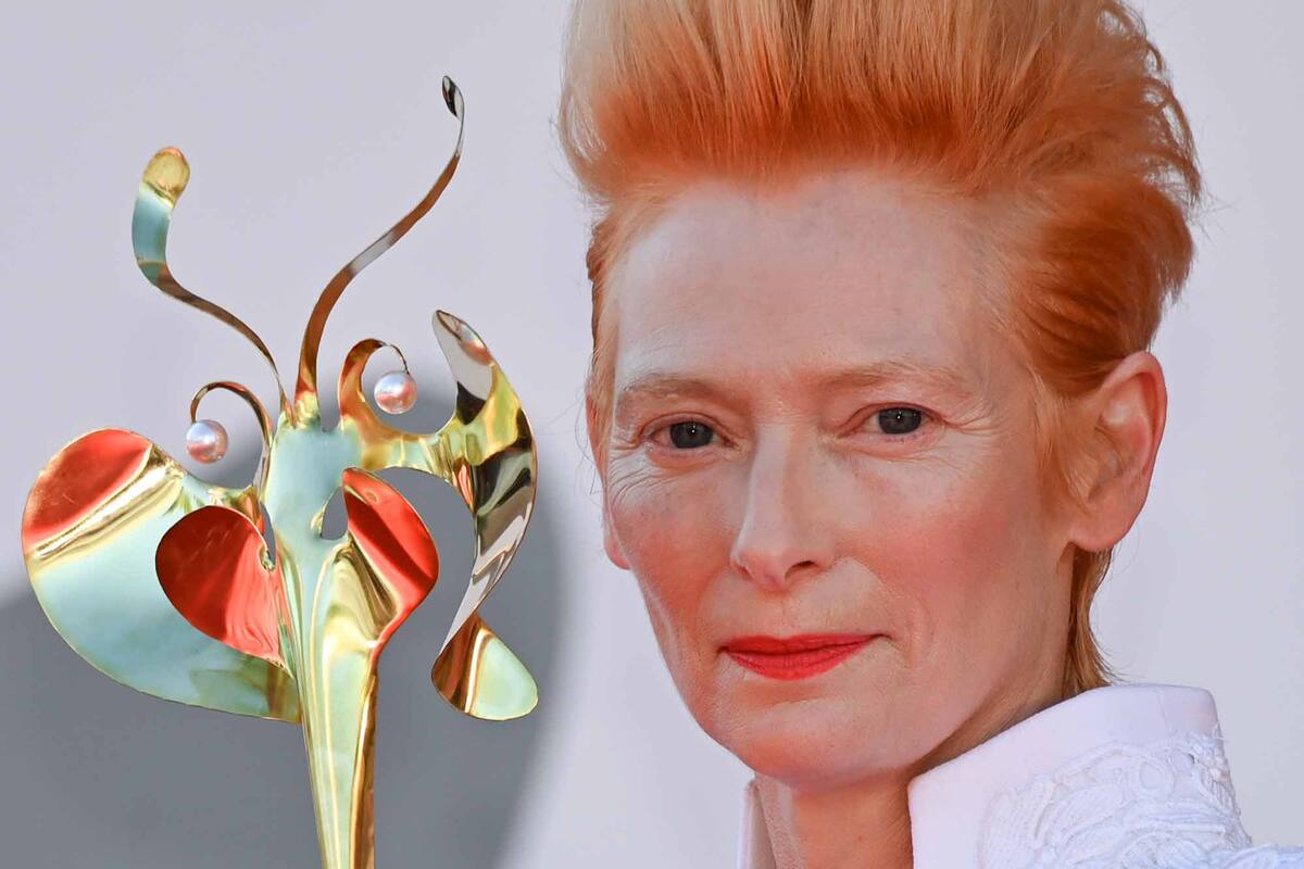 Tilda Swinton holds a gilded masquerade mask as she arrives for the screening of the film "The Human Voice" presented out of competition on the second day of the 77th Venice Film Festival, on September 3, 2020 at Venice Lido, during the COVID-19 infection
