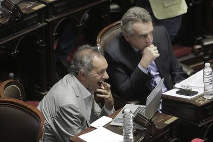 Daniel Scioli y Agustín Rossi, durante la sesión