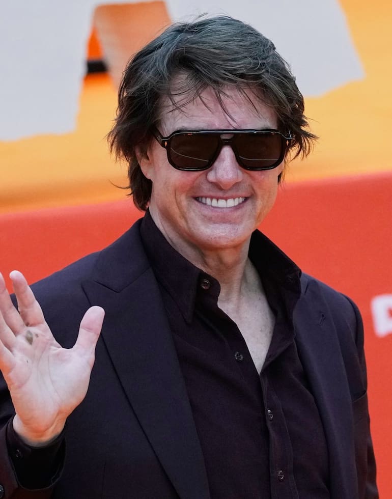 Tom Cruise poses for photos during a red carpet fan event promoting the film "Digger," in Mexico City, Friday, Sept. 25, 2026. (AP Photo/Marco Ugarte)