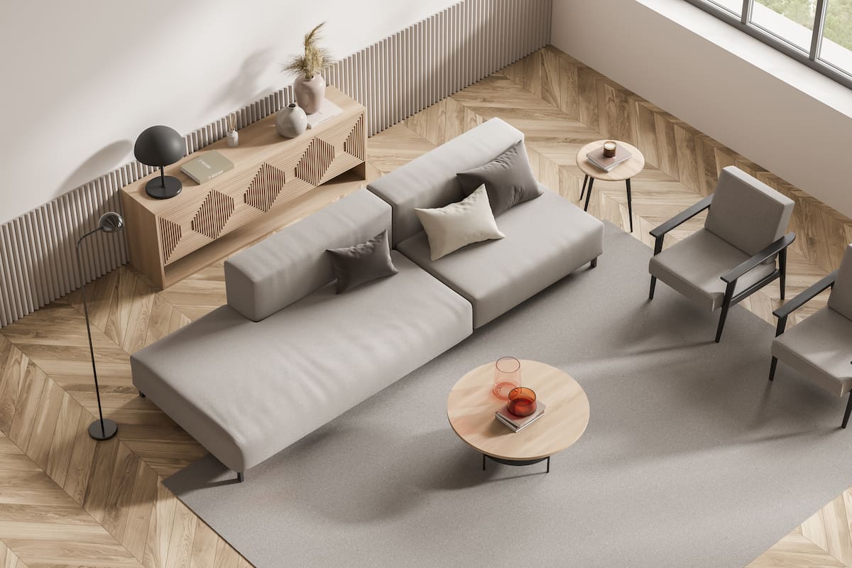 Top view on bright living room interior with large brown sofa, two cozy armchairs, carpet, pillows, panoramic window, sideboard with lamp, books. Concept of comfortable place for meeting. 3d rendering